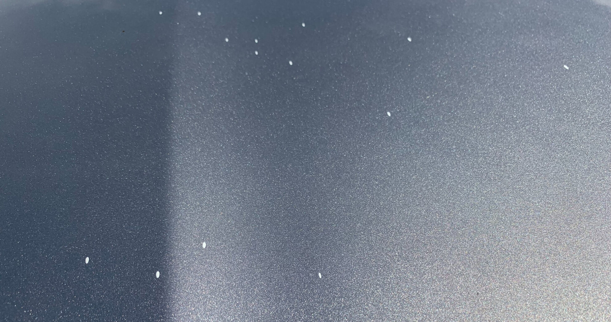 Spatter from paint that dripped from the Sherman Minton Bridge onto Mike Scheser's car